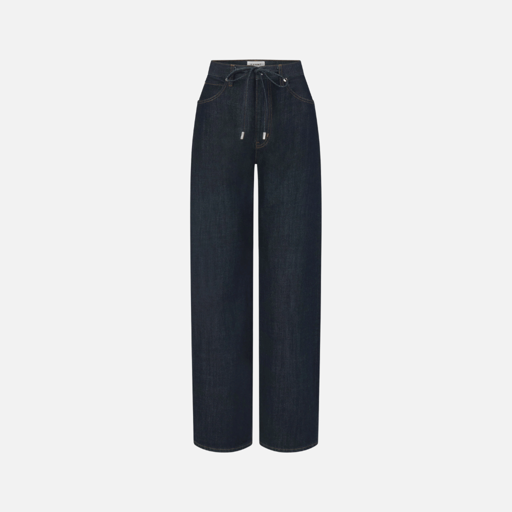 FRAME The Off Duty Drawstring Bow Jeans in Rinse at Riada Concept. High-rise fluid denim with a curved leg and drawstring waist. 