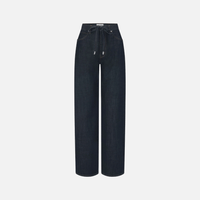 FRAME The Off Duty Drawstring Bow Jeans in Rinse at Riada Concept. High-rise fluid denim with a curved leg and drawstring waist. 