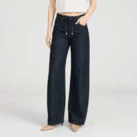 FRAME The Off Duty Drawstring Bow Jeans in Rinse at Riada Concept. High-rise fluid denim with a curved leg and drawstring waist - front view