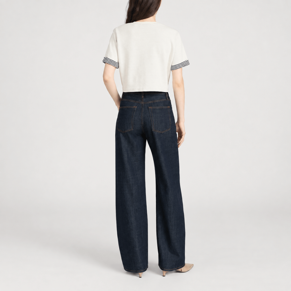 FRAME The Off Duty Drawstring Bow Jeans in Rinse at Riada Concept. High-rise fluid denim with a curved leg and drawstring waist - back view