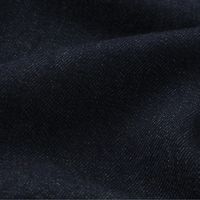 FRAME The Off Duty Drawstring Bow Jeans in Rinse at Riada Concept. High-rise fluid denim with a curved leg and drawstring waist - fabric close up