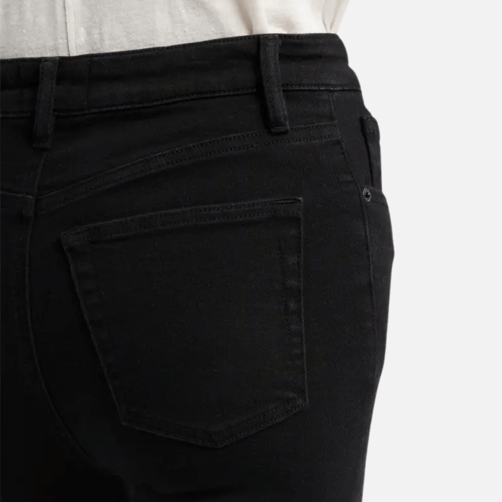 FRAME The Reboot Crop Jeans in Levitate at Riada Concept. High-rise black bootcut jeans in super-stretch denim with a 27-inch inseam and cropped flare - waistband and back pocket view