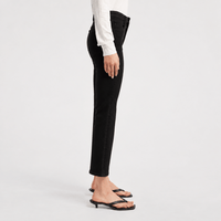 FRAME The Reboot Crop Jeans in Levitate at Riada Concept. High-rise black bootcut jeans in super-stretch denim with a 27-inch inseam and cropped flare - side view