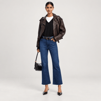 FRAME The Reboot Crop Jeans in Trick dark indigo high-rise cropped bootcut on model fullbody
