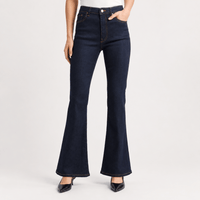 Model shot FRAME The Reboot Jeans in Stargirl at Riada Concept. High-rise full-length bootcut jeans in dark indigo stretch denim with golden contrast stitching.
