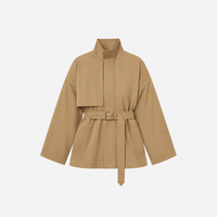 FRAME The Short Field Trench in Khaki at Riada Concept. Relaxed cotton jacket with a stand collar, storm flap and adjustable belt