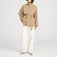 FRAME The Short Field Trench in Khaki at Riada Concept. Relaxed cotton jacket with a stand collar, storm flap and adjustable belt - styled model front view