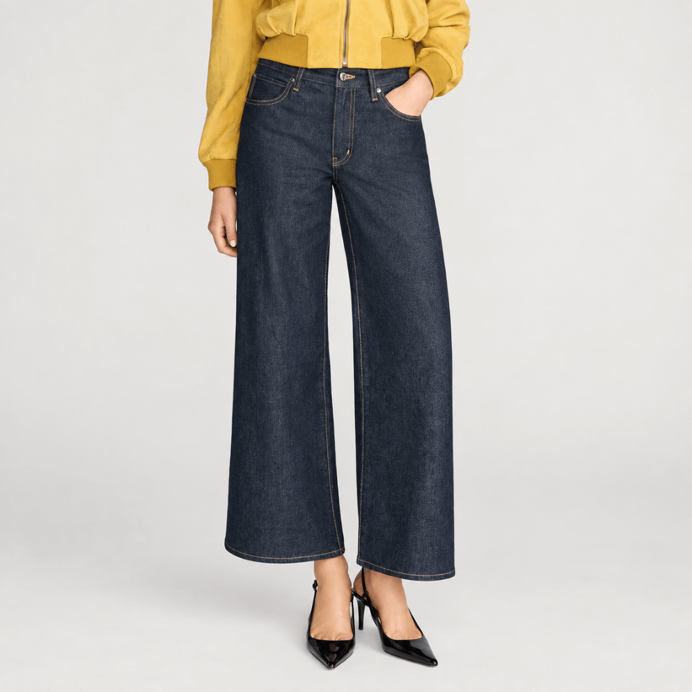 FRAME The Swing Jeans in Rinse at Riada Concept. High-rise cropped wide-leg jeans in rigid dark-indigo regenerative cotton - front view