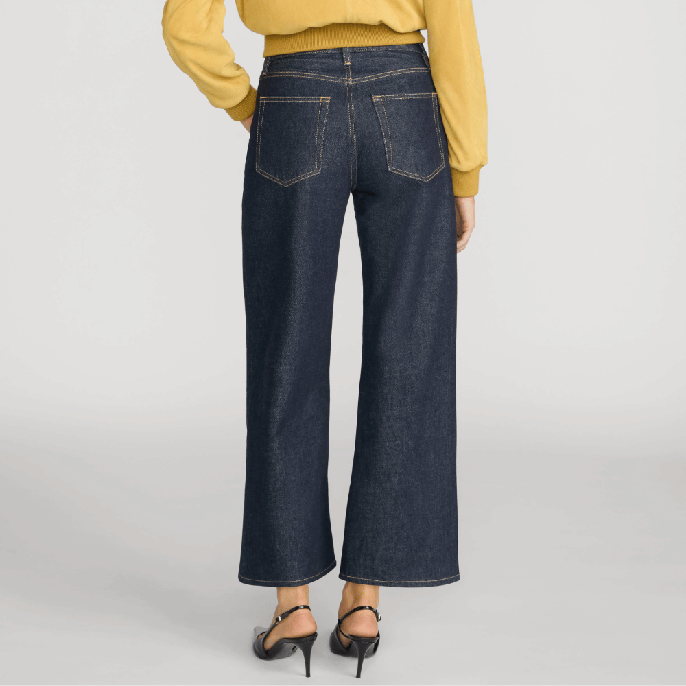 FRAME The Swing Jeans in Rinse at Riada Concept. High-rise cropped wide-leg jeans in rigid dark-indigo regenerative cotton - back view