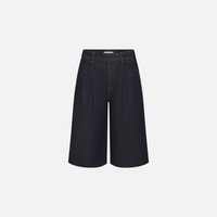 FRAME The Tailored Short in Rinse at Riada Concept. High-rise rigid denim Bermuda shorts with front pleats and a wide culotte leg 