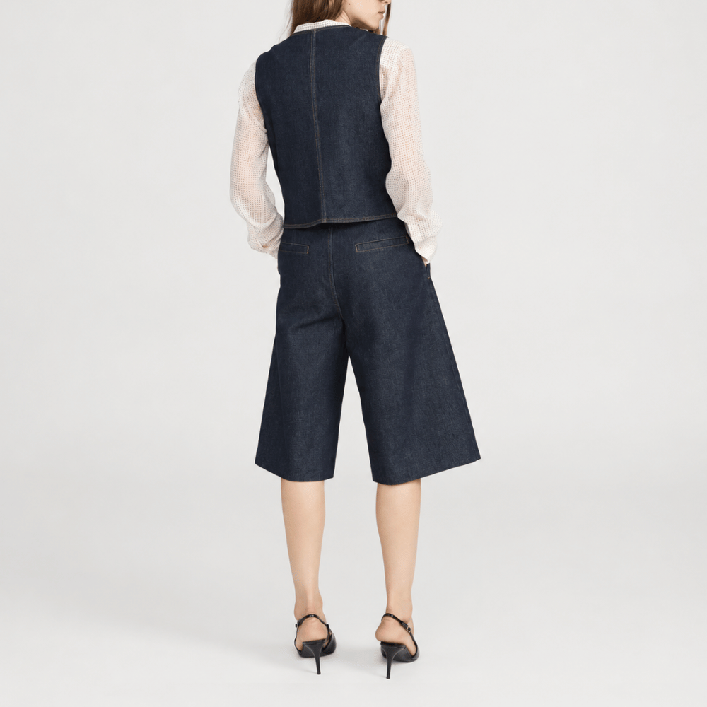 FRAME The Tailored Short in Rinse at Riada Concept. High-rise rigid denim Bermuda shorts with front pleats and a wide culotte leg - back view