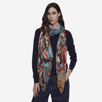 Faliero Sarti Woman Power scarf draped over a navy sweater and dark denim