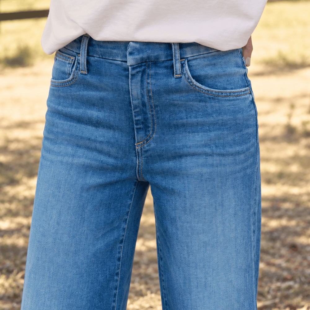 Frank & Eileen Galway 32" wide-leg jeans in 2002 Wash, close view showing mid-rise waistband and pockets