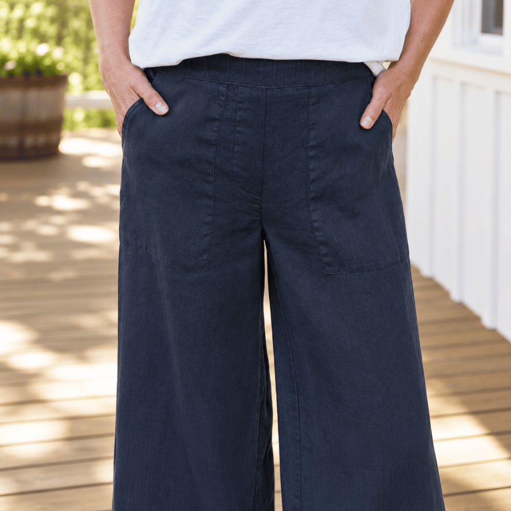 Frank & Eileen Madeline navy linen pants, close view showing flat waistband, patch pockets and wide leg