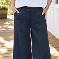 Frank & Eileen Madeline navy linen pants, close view showing flat waistband, patch pockets and wide leg