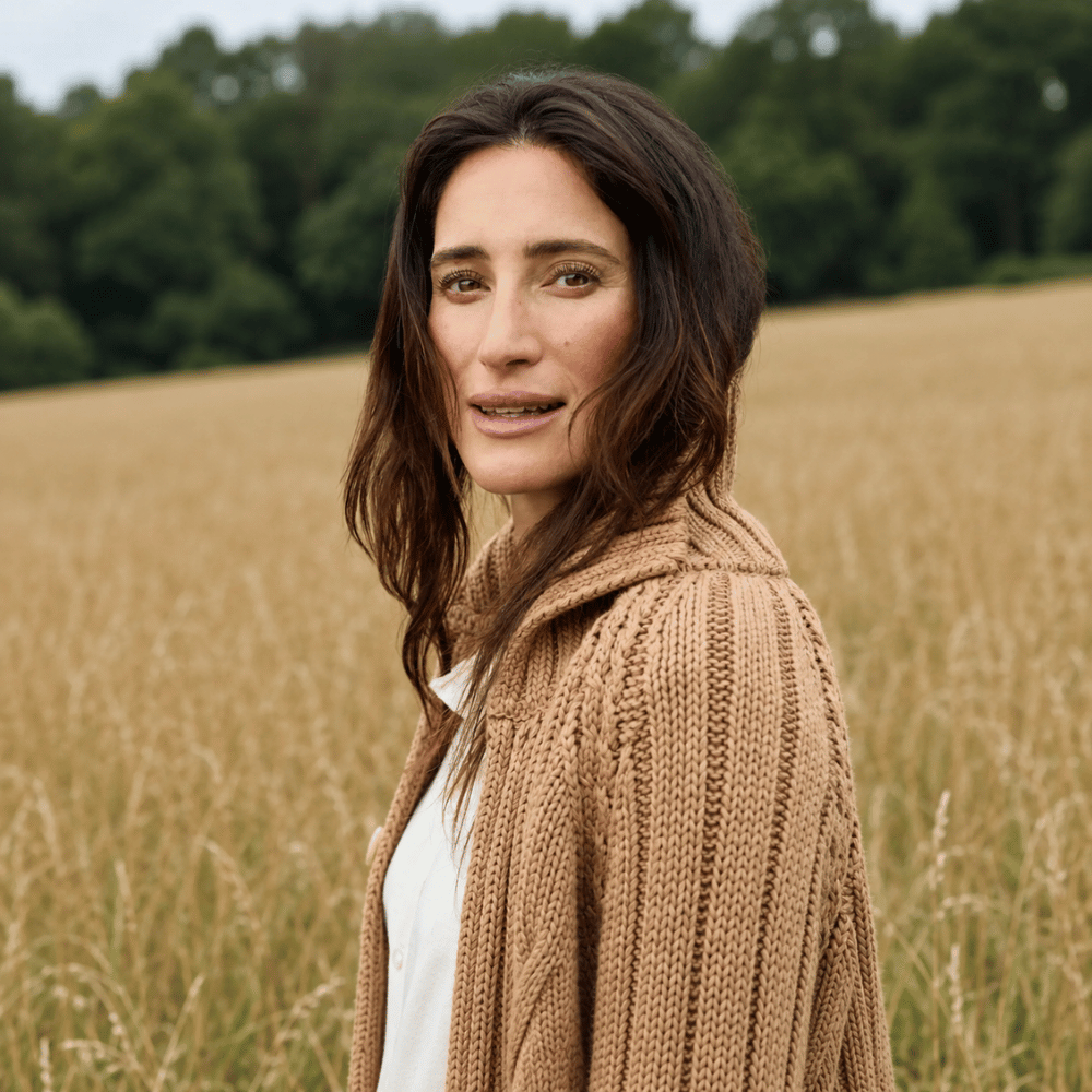 Frank & Eileen Mini Cotswolds cable knit cardigan in Camel, styled side view showing stand collar