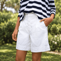 Frank & Eileen Waterford 7.5" linen shorts in White, angled view showing high-rise waist, pockets and wide leg