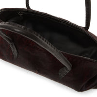 Riada Concept Henry Beguelin’s Bolla Bassa in streaked wine pony-hair calf: a low, rounded shoulder bag with black leather handles and beaded pulls, handcrafted in Italy - interior view
