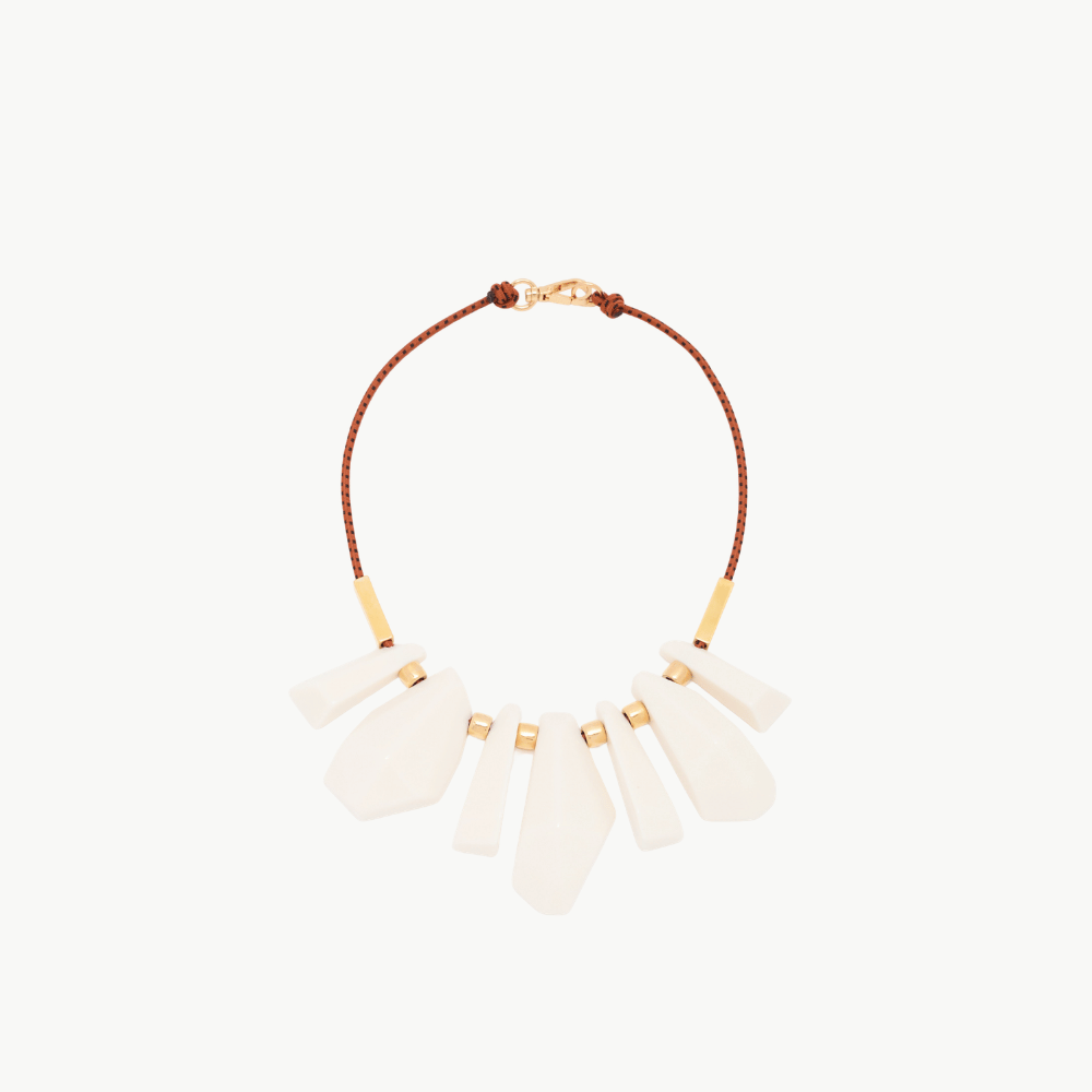 Plan C Irregular Milk Pendants Necklace with ivory sculptural pendants, tobacco cord and gold-tone spacers