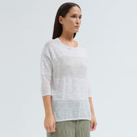 An oversized white jacquard knit by Transit Par Such with a round neck, dropped shoulders, elbow-length sleeves and semi-sheer openwork stripes - angle view