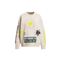 Riada Concept Essentiel Antwerp relaxed cream cotton sweatshirt, covered in colourful slogans, with a sequinned heart, beaded sleeve lettering and a 1999 back panel