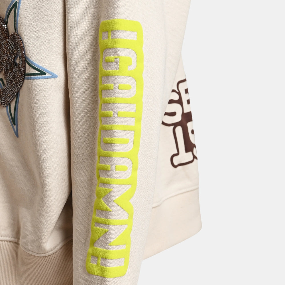 Riada Concept Essentiel Antwerp relaxed cream cotton sweatshirt, covered in colourful slogans, with a sequinned heart, beaded sleeve lettering and a 1999 back panel, close-up sleeve lettering