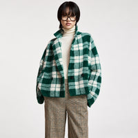 Riada Concept Essentiel Antwerp Karreau knit cardigan in a forest green and off-white check, double-breasted with notched lapels, dropped shoulders and slanted pockets - model front cropped view