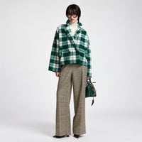 Riada Concept Essentiel Antwerp Karreau knit cardigan in a forest green and off-white check, double-breasted with notched lapels, dropped shoulders and slanted pockets - styled model front view