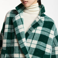 Riada Concept Essentiel Antwerp Karreau knit cardigan in a forest green and off-white check, double-breasted with notched lapels, dropped shoulders and slanted pockets - close up 
