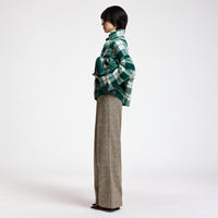 Riada Concept Essentiel Antwerp Karreau knit cardigan in a forest green and off-white check, double-breasted with notched lapels, dropped shoulders and slanted pockets - styled model side view
