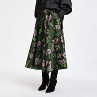 Riada Concept A full circle midi skirt by Essentiel Antwerp in khaki floral jacquard with pink and green flowers, a fitted waistband, side-seam pockets and a full lining - cropped front view