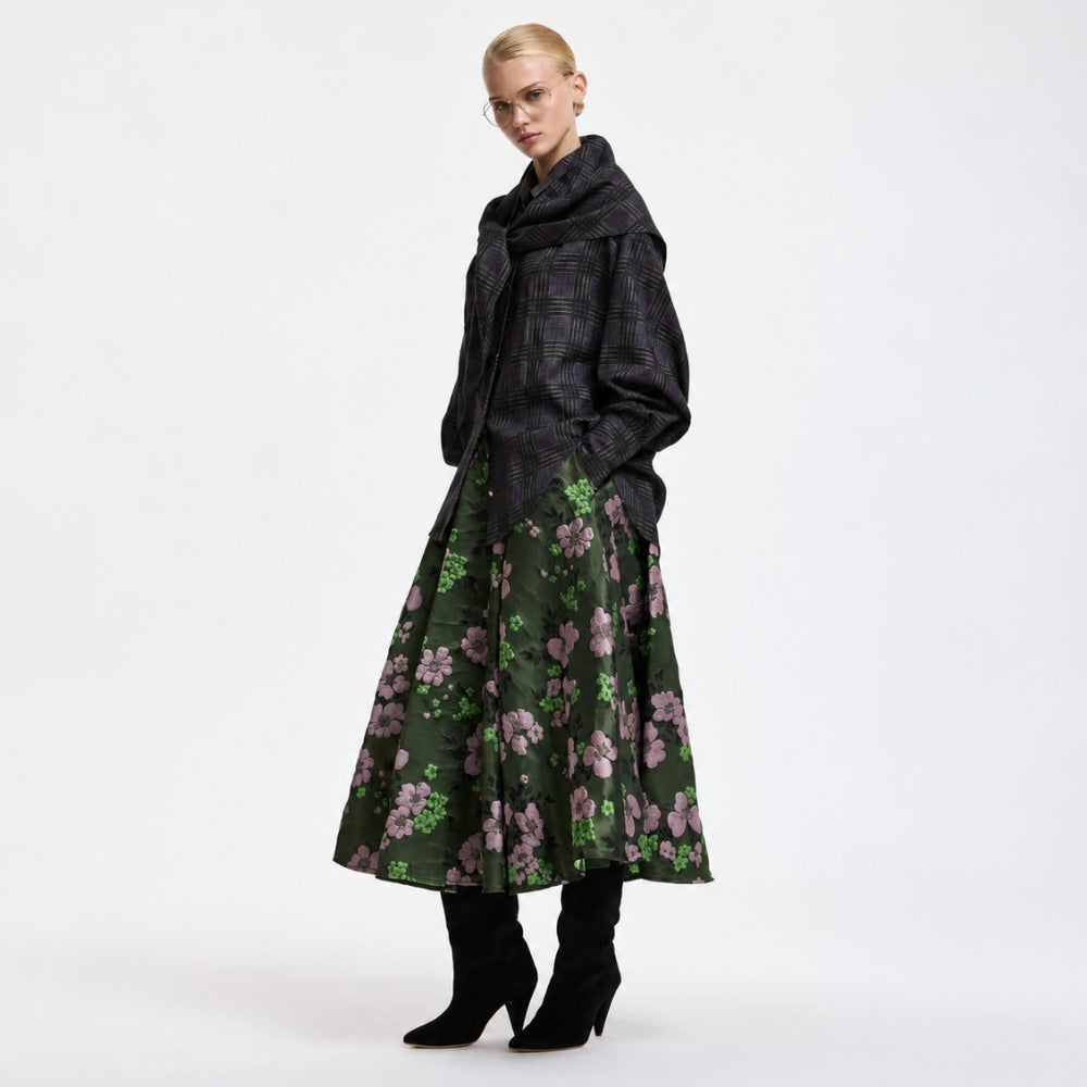Riada Concept A full circle midi skirt by Essentiel Antwerp in khaki floral jacquard with pink and green flowers, a fitted waistband, side-seam pockets and a full lining - styled model angle view