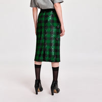 Riada Concept Essentiel Antwerp green and black check pencil skirt, covered in sequins on stretch jersey, with an elasticated waistband and a back slit. Midi length - back view