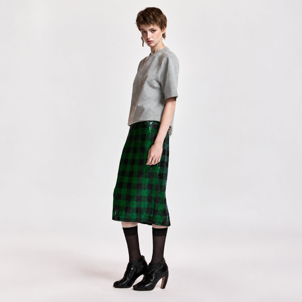 Riada Concept Essentiel Antwerp green and black check pencil skirt, covered in sequins on stretch jersey, with an elasticated waistband and a back slit. Midi length - angle view