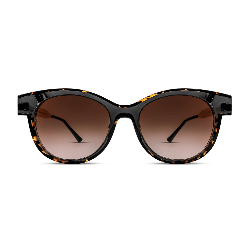Thierry Lasry LYTCHY cat-eye sunglasses in translucent black and tortoiseshell with gradient brown lenses, front view