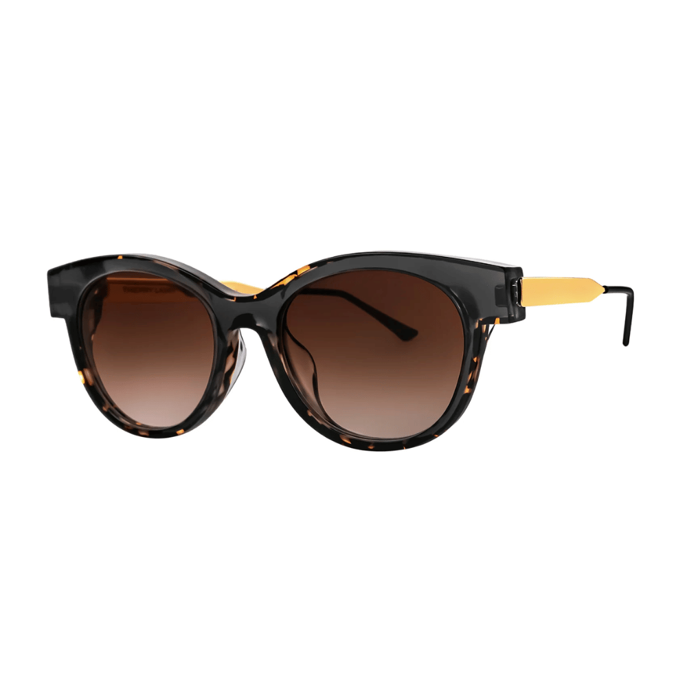 Thierry Lasry LYTCHY cat-eye sunglasses in black and tortoiseshell with faceted gold metal temples, three-quarter view