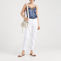 FRAME Le High Straight Cropped Jeans in Blanc at Riada Concept. High-rise slim straight white denim with strong stretch recovery - front view styled model