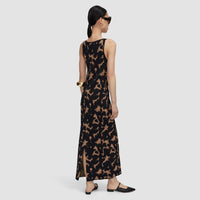 Back view of the JOSEPH Lecate tortoiseshell knit dress, showing the slit at the hem