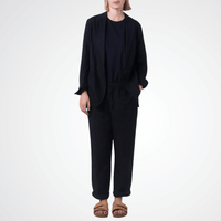 Transit Par Such Linen Slim Pant in Black — Italian-made tapered linen trousers with high waist and side pockets, styled with black blazer and sandals Transit Par Such at Riada Concept Designer fashion shop online and in store High End fashion boutique Sydney Australia Riada Concept