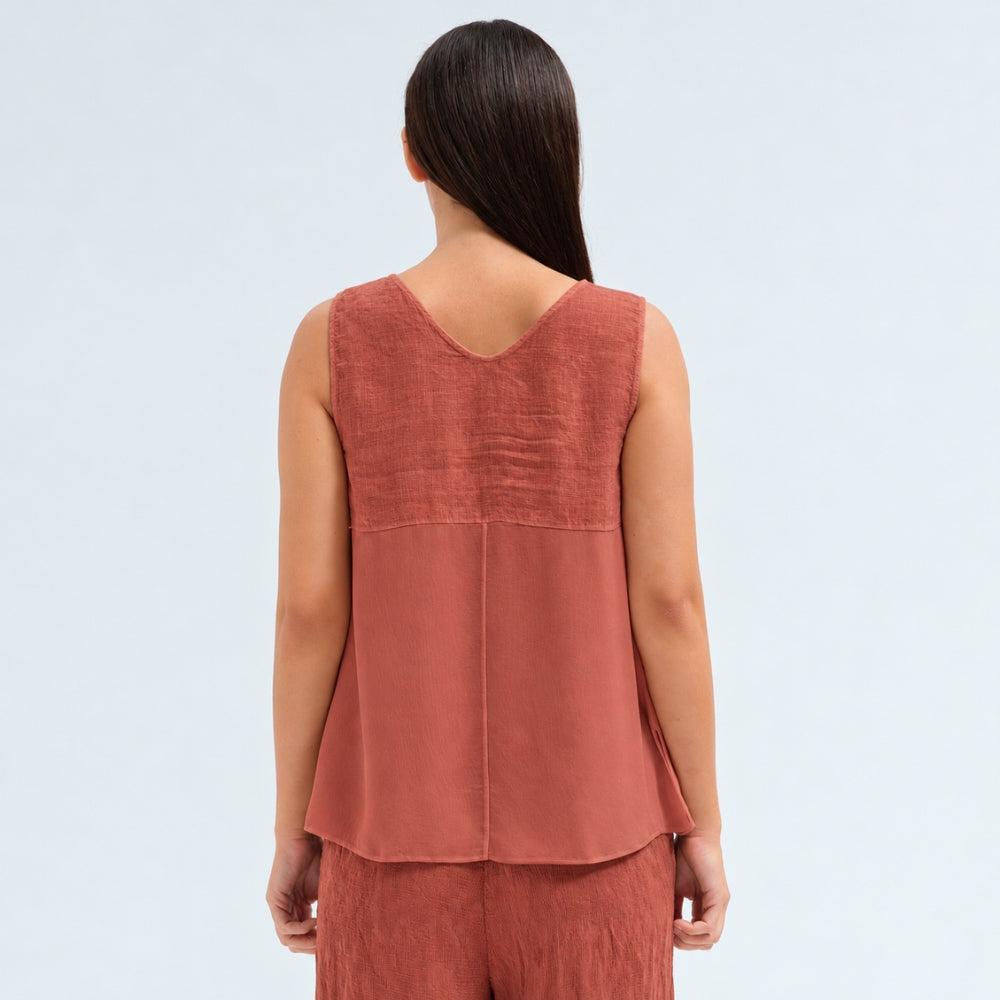 A sleeveless brick tank by Transit Par Such with a V-neck, a linen upper and a viscose georgette lower that widens to the hem - back view