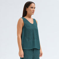 A sleeveless petrol tank by Transit Par Such with a V-neck, a linen upper and a viscose georgette lower that widens to the hem - angle view