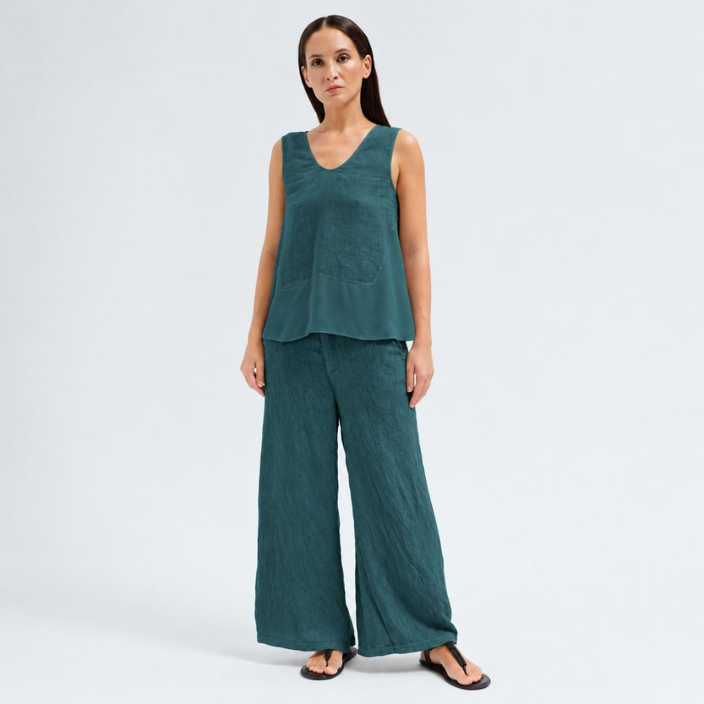 A sleeveless petrol tank by Transit Par Such with a V-neck, a linen upper and a viscose georgette lower that widens to the hem - full body view