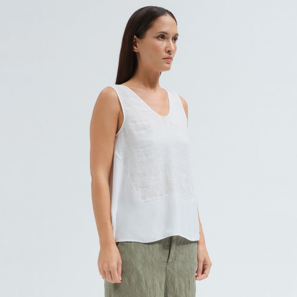 A sleeveless white tank by Transit Par Such with a V-neck, a linen upper and a viscose georgette lower that widens to the hem - side view