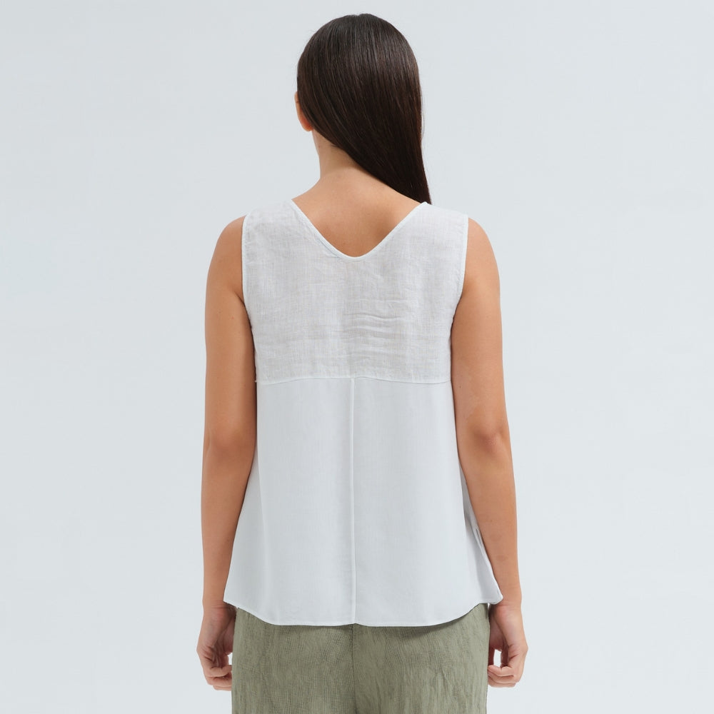 A sleeveless white tank by Transit Par Such with a V-neck, a linen upper and a viscose georgette lower that widens to the hem - back view
