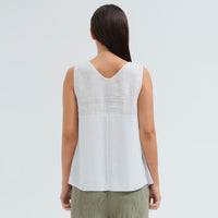 A sleeveless white tank by Transit Par Such with a V-neck, a linen upper and a viscose georgette lower that widens to the hem - back view