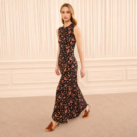 Riada Concept Ulla Johnson Orla sleeveless jersey dress in a black floral print, sculpted at the waist with a relaxed skirt.
