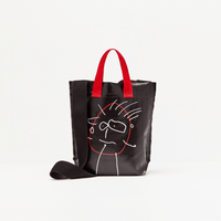 Plan C Pili & Bianca Mini Shopper Bag in Black with white character artwork, red handles and black shoulder strap - rear view