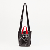 Plan C Pili & Bianca Mini Shopper Bag in Black with white character artwork, red handles and black shoulder strap - front view