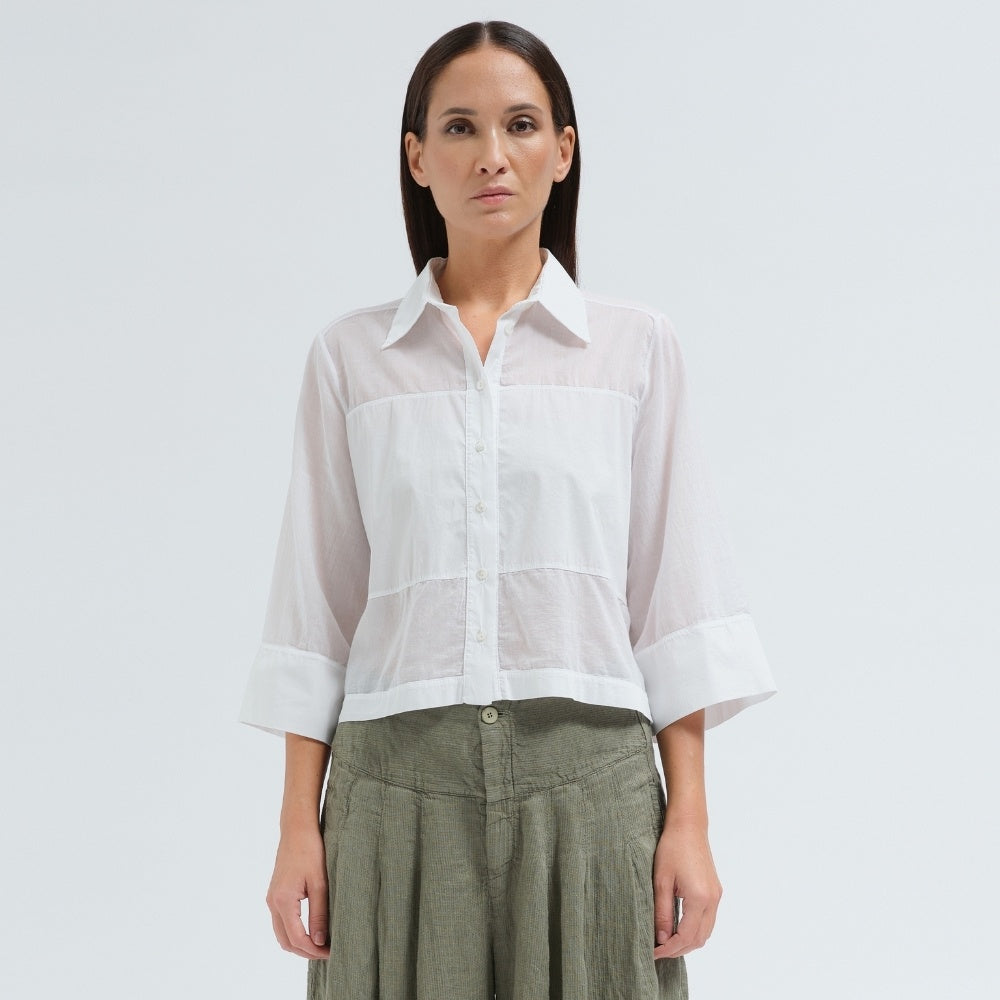 A boxy, cropped black shirt by Transit Par Such in stretch poplin with sheer panels, a pointed collar and three-quarter sleeves with wide cuffs - front view