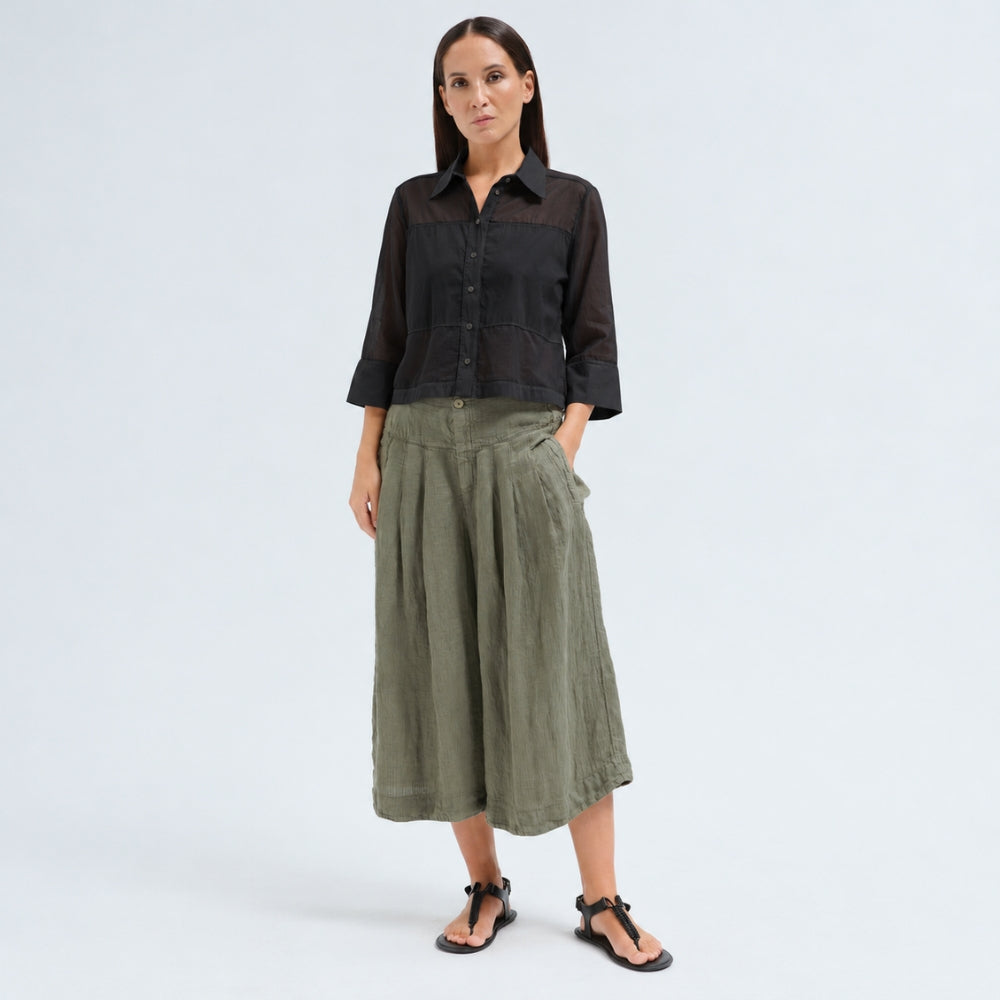 A boxy, cropped black shirt by Transit Par Such in stretch poplin with sheer panels, a pointed collar and three-quarter sleeves with wide cuffs - full front view